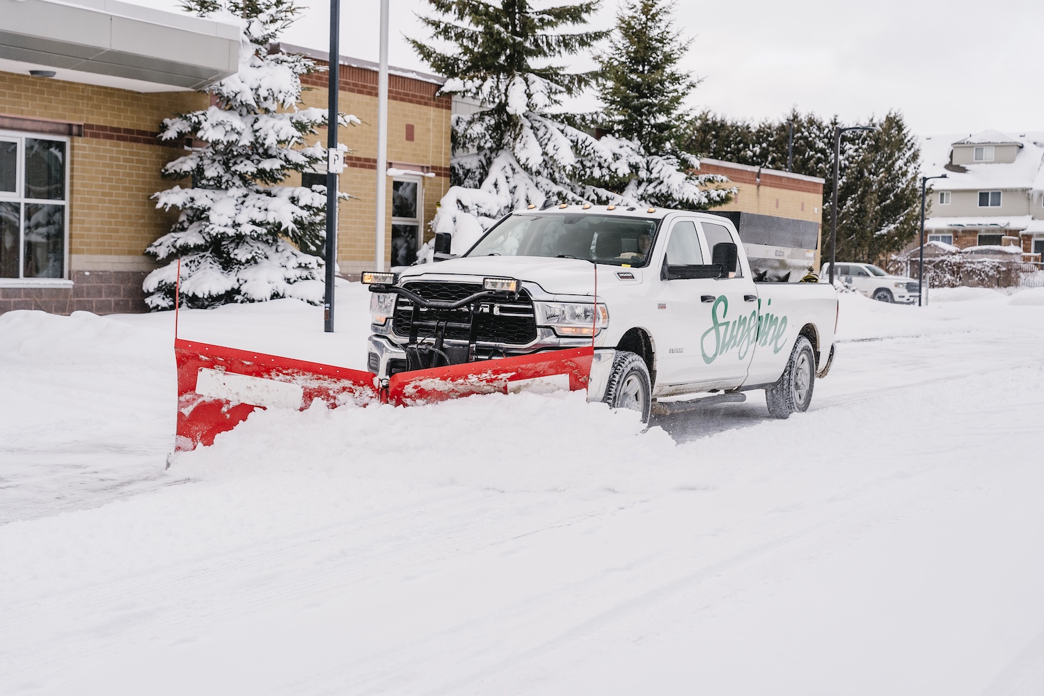 Residential snow plowing and ice removal by Sunshine Landscape
